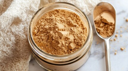 High-Quality Collagen Powder in Glass Jar with Scoop, Natural Supplement Ideal for Health and Wellness, Close-Up of Nourishing Ingredients on Marble Surface