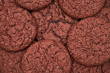 A white plate filled with chocolate cookies