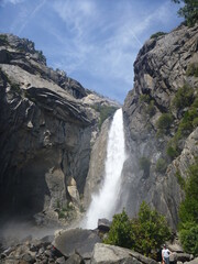 Waterfall cascading down rocks and rocky outcrop in Yosemite, California