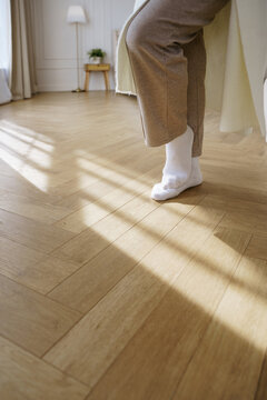 Woman's feet in her bedroom