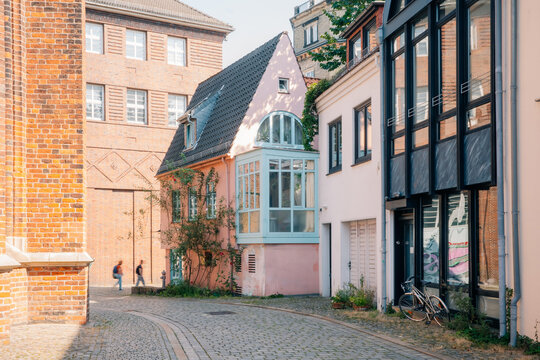 Alleyway with colorful buildings and a bike in a quiet urban street