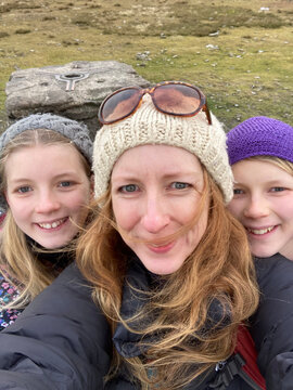 Mum and daughters selfie while hiking