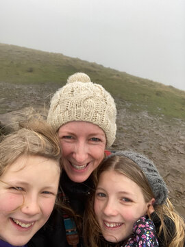 Mum and daughters selfie while hiking