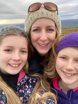 Mum and daughters selfie while hiking