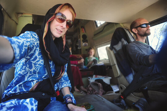 A selfie of a family in their van 