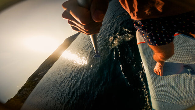 Man using a stand-up paddle board