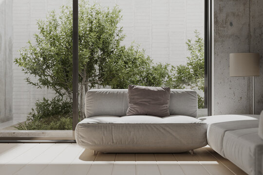 Sofa couch in modern room interior design with garden on background