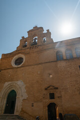 Cityscape with old historical buildings, narrow street and restaurants in Agrigento, Sicily, Italy