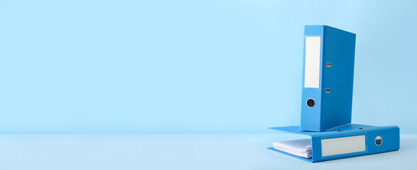 Office folders on color background