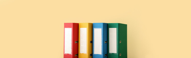 Office folders on color background