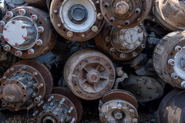Scrapped truck axles in a scrapyard