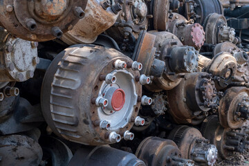 Scrapped truck axles in a scrapyard