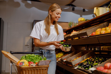A young woman delights in choosing fresh produce while strolling through a lively and colorful market ambiance