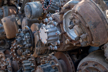 Scrapped truck axles in a scrapyard