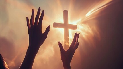 Fototapeta premium Silhouettes of hands reaching towards a cross with a glowing sun behind it, a symbol of faith and hope.