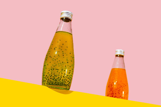bottles of kiwi and mango drinks with basil seeds