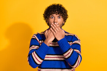 Photo of pretty young male hands cover mouth nervous keep secret wear trendy blue striped outfit...