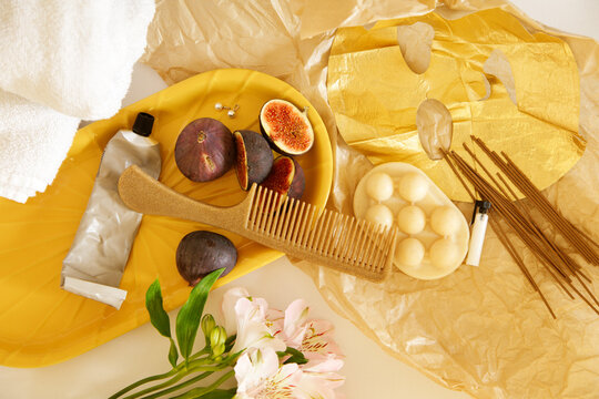 Flat lay with cosmetics  and fruits on a white background 