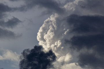 big clouds in the sky before the storm at sunset