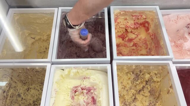 Scooping black raspberry chip ice cream

