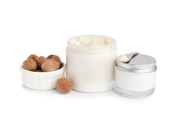 Jars with shea butter and cosmetic cream on white background
