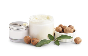 Jars with shea butter and cosmetic cream on white background