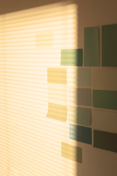 Colourful notes and papers on work corporate office business wall