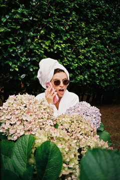 Surprised woman gossiping on the phone