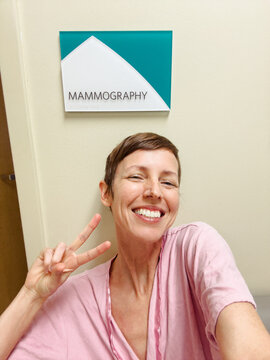 Woman Taking Selfie While Waiting for Mammogram 