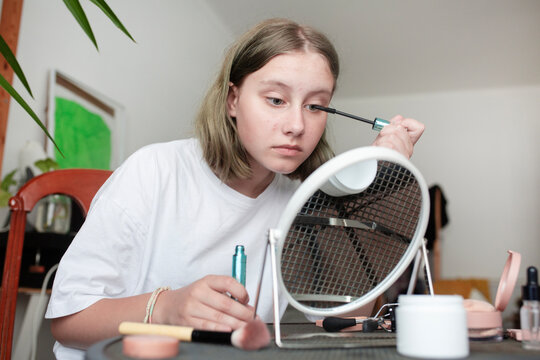 Girl Teenager puts on makeup 