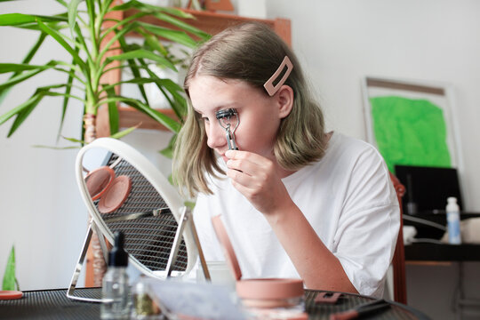 Girl Teenager puts on makeup 