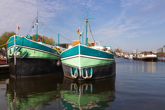 two barges docked in amsterdam