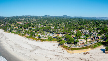 drone view of Carmel by the sea, California with town and beach
