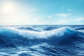 The ocean is calm and blue, with a wave cresting in the distance