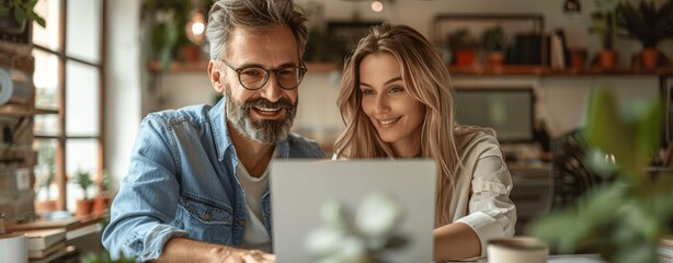 Young professionals discussing a project in a bright office