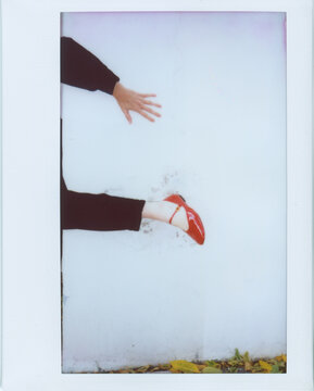 Anonymous woman in red shoe - Instax photo