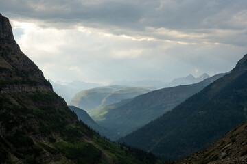 Sun Breaks Through Rain Clouds To Light Distant Mountains Beyond Mount Oberlin