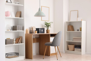 Interior of modern home office with safe on wooden table