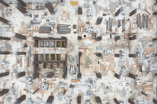 Aerial View of Large Construction Site with Building Materials a