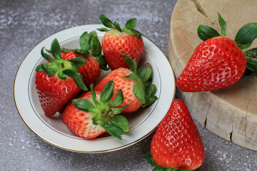 Fresh Strawberries in white bowl. Organic healthy. Summer red fruit with Copy space for text.  