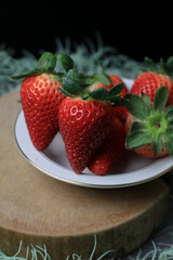 Fresh Strawberries in white bowl. Organic healthy. Summer red fruit with Copy space for text.  