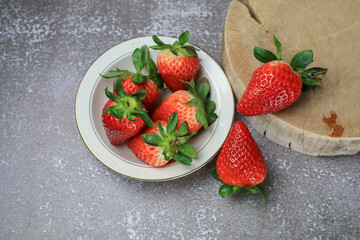 Fresh Strawberries in white bowl. Organic healthy. Summer red fruit with Copy space for text.  