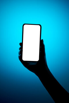 Female hand holding smartphone with white isolated screen mockup