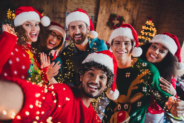 Photo of nice young people take selfie photo video call enjoy cozy christmas decoration interior house indoors party