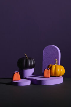 Yellow pumpkin displayed on various purple geometric shapes