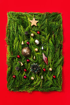 Pine tree branches and ornaments framed as rectangle 