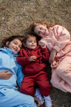 Kids playing in a parc with colourful tracksuit
