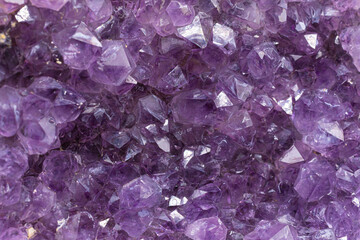 An abstract image of the sparkling texture of an amethyst geode crystal