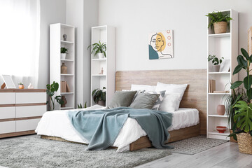 Interior of stylish bedroom with houseplants