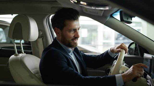 Caucasian client man buyer guy customer businessman male luxury new car choosing auto showroom choose automobile touch wheel salon rent service test drive vehicle driver owner purchase business credit